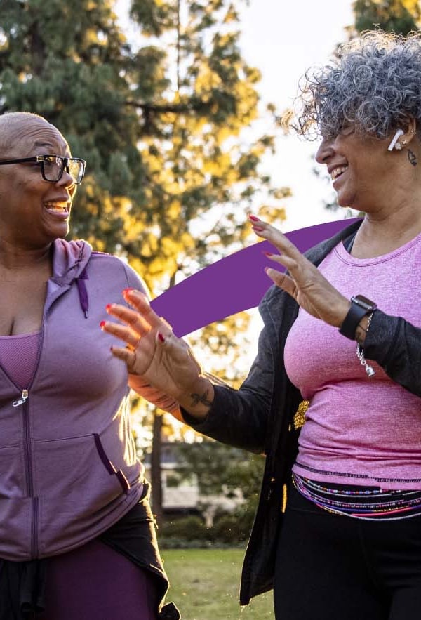 happy ladies in purple clothes